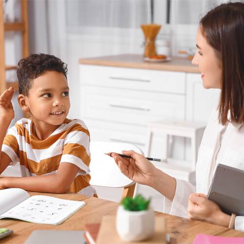 Woman tutoring small child