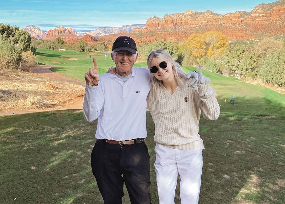 father and daughter on golf course