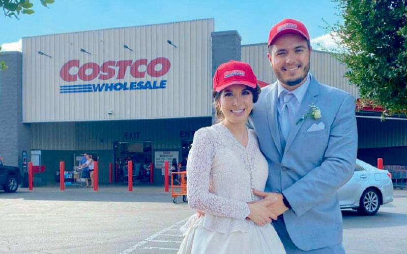 man and woman in front of costco