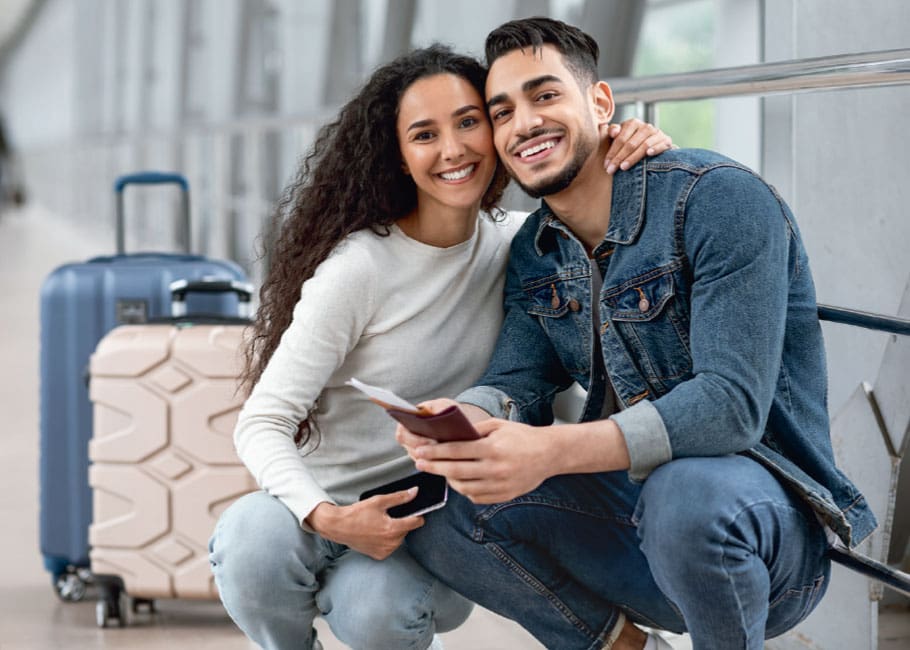 couple with luggage and passports