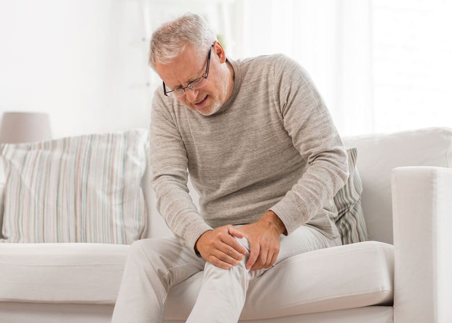 a man holding his knee
