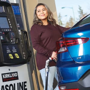 woman at gas pump
