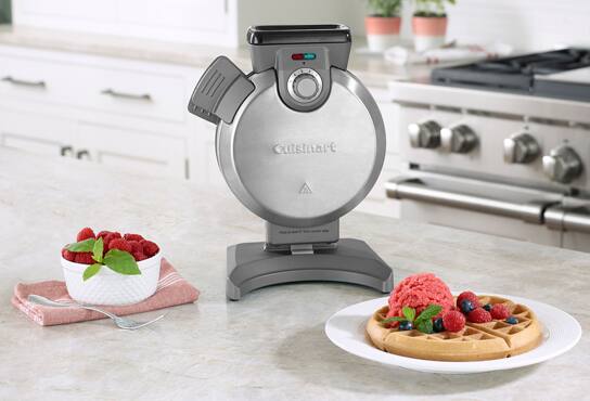 A waffle iron in a family kitchen.